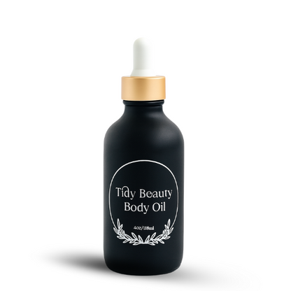 Black bottle of Tidy Beauty Body Oil with a dropper on a white background